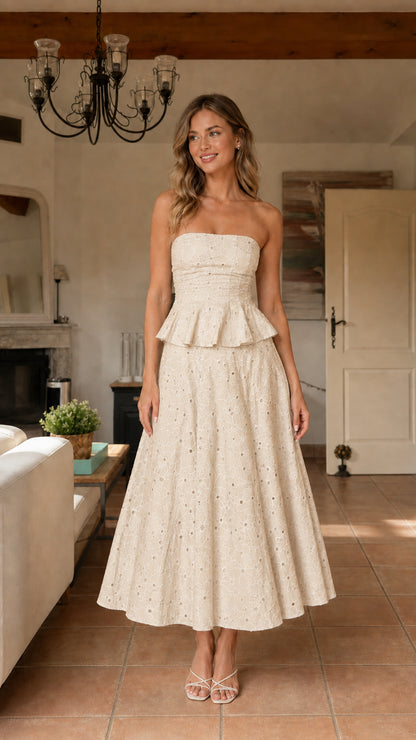 Model wearing cream strapless eyelet midi dress